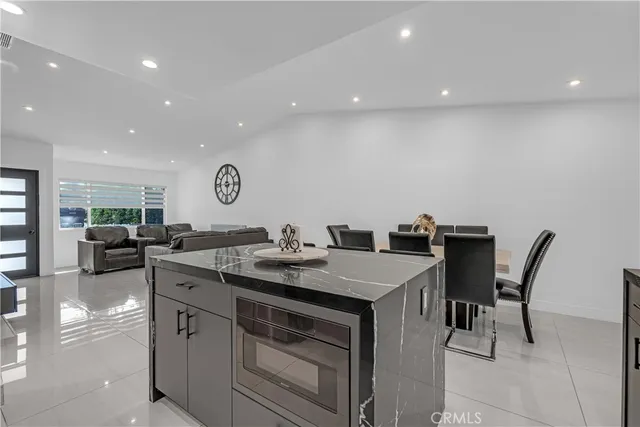 a kitchen with a table chairs and a stove