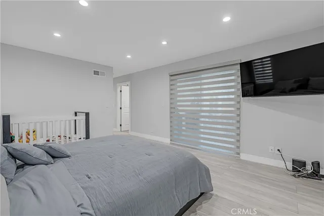 a bedroom with a bed and a walk in closet