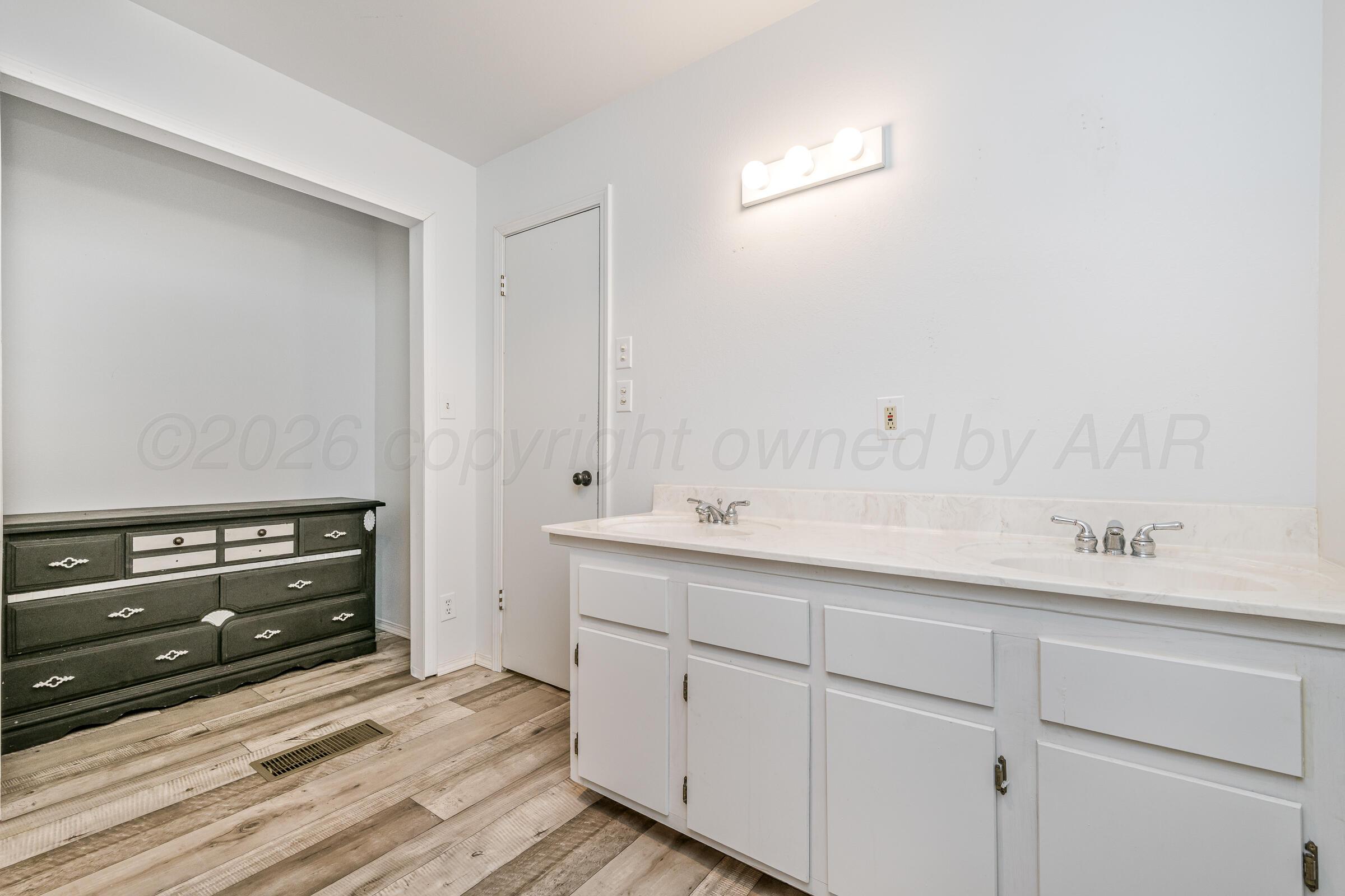 910 8th Avenue Canyon, TX 79015 - Photo 21 of 22 a utility room with cabinets