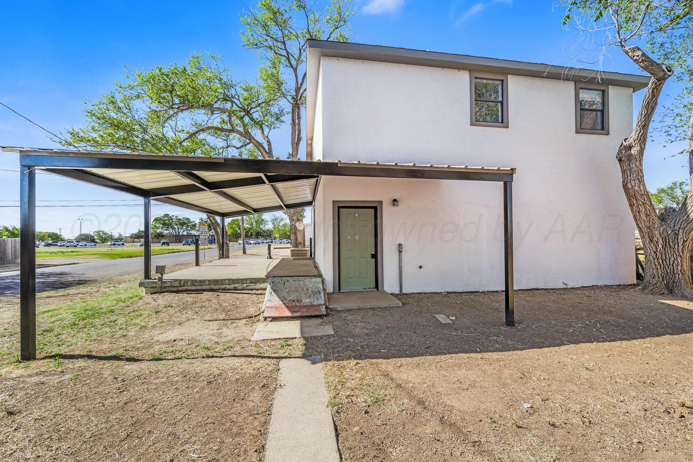 910 8th Avenue Canyon, TX 79015 - Photo 3 of 22 a front view of a house with a porch