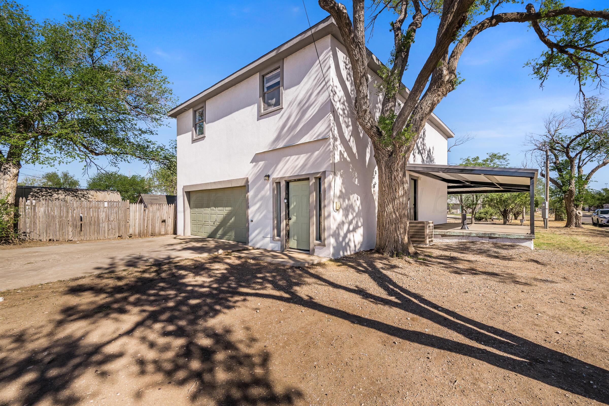 910 8th Avenue Canyon, TX 79015 - Photo 5 of 22 a view of a house with a tree in front