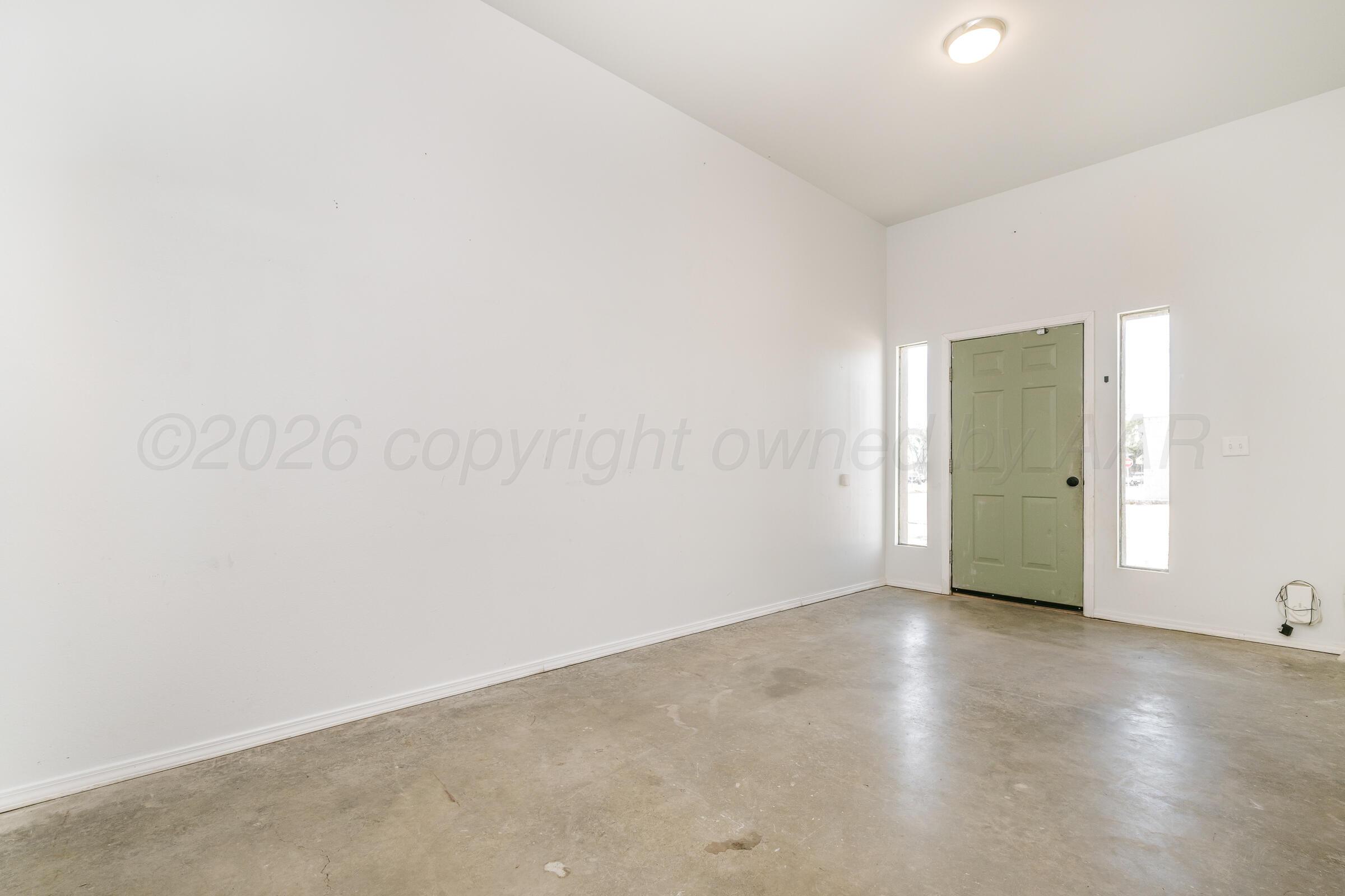 910 8th Avenue Canyon, TX 79015 - Photo 8 of 22 an empty room with closet area