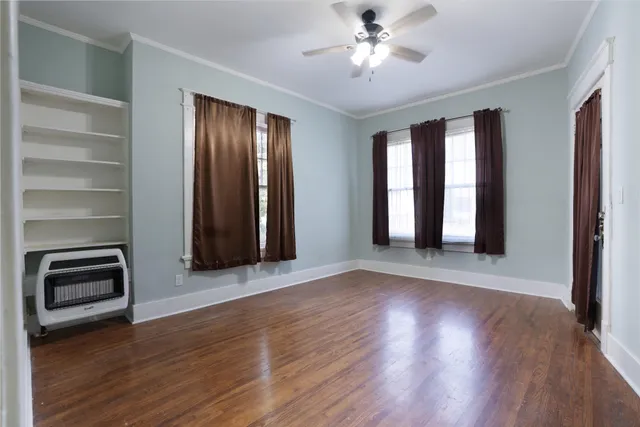 a kitchen with granite countertop a stove a sink and a microwave