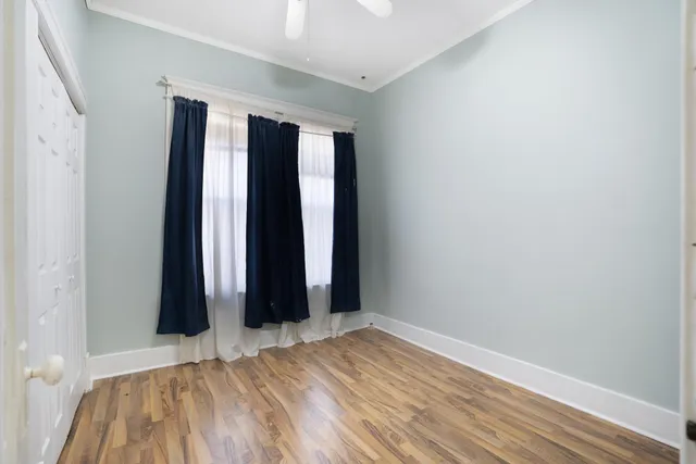 a kitchen with a refrigerator sink and white cabinets