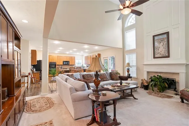 a kitchen with stainless steel appliances granite countertop a refrigerator stove top oven and sink