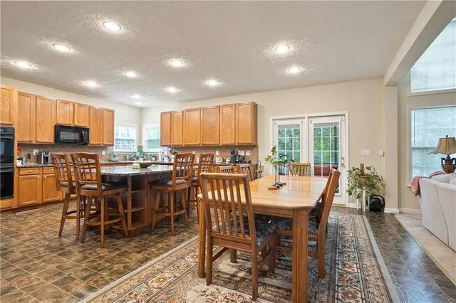 a view of a dining room with furniture