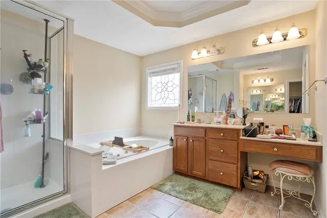 a room with furniture a flat screen tv and a window