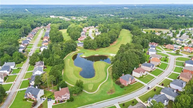 an aerial view of residential house with outdoor space and pool