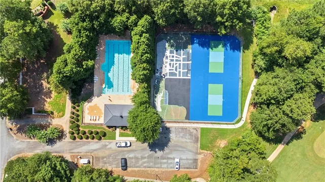 an aerial view of a house with a yard and garden