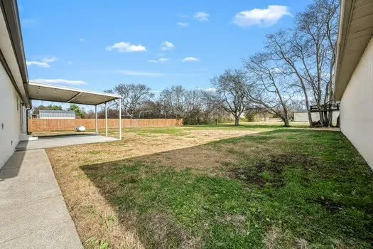 a view of a backyard of a house