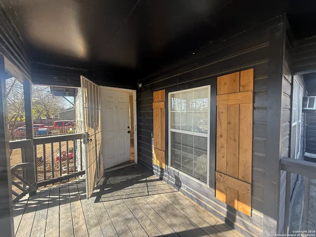 a bedroom with bed and a chandelier