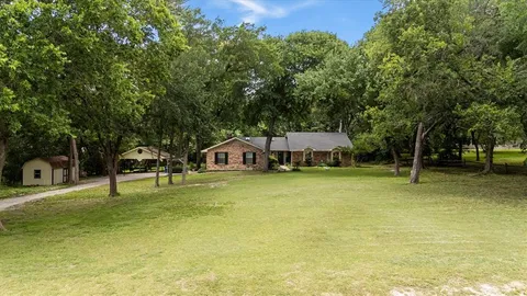a view of a house with swimming pool and sitting area