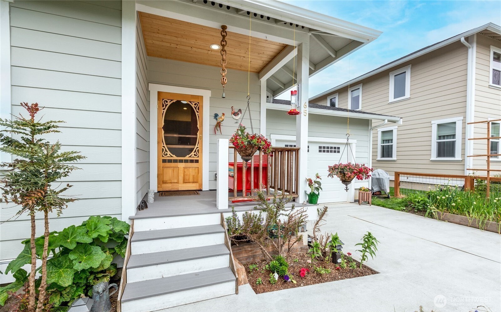 65 Gerard Lane Friday Harbor, WA 98250 - Photo 2 of 21 a front view of a house with potted plants