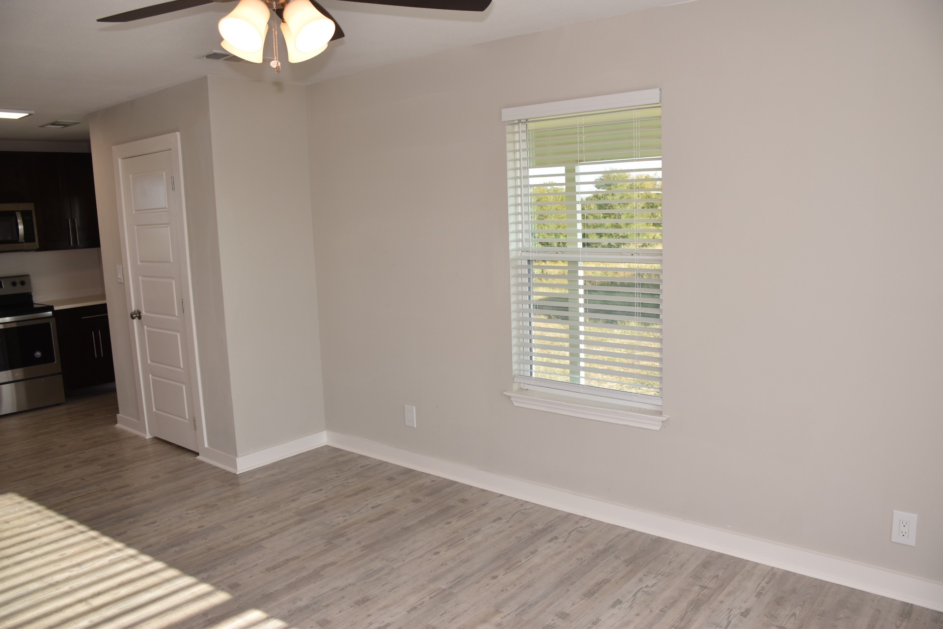 3751 County Road 463 Elgin, TX 78621 - Photo 9 of 27 a view of an empty room with wooden floor and a window