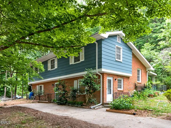 a house with a tree in front of it