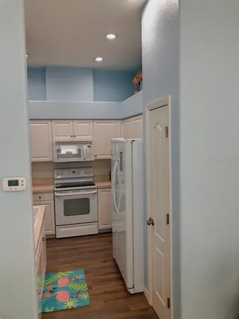 a kitchen with stainless steel appliances a stove and a refrigerator