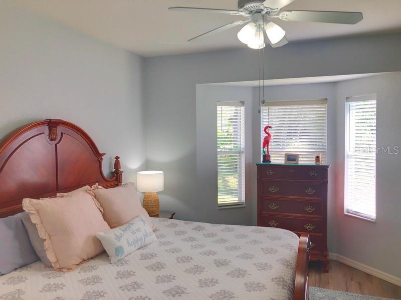 1211 Hot Springs Point Englewood, FL 34223 - Photo 17 of 30 a bedroom with a large bed and a window