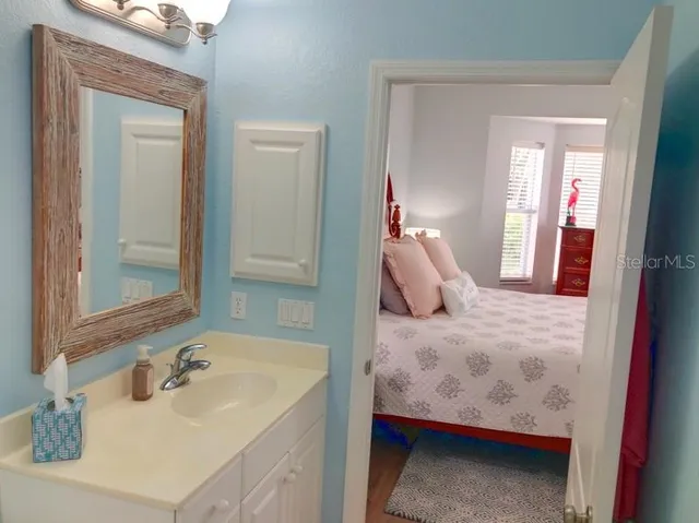 a en suite bathroom with a sink and mirror