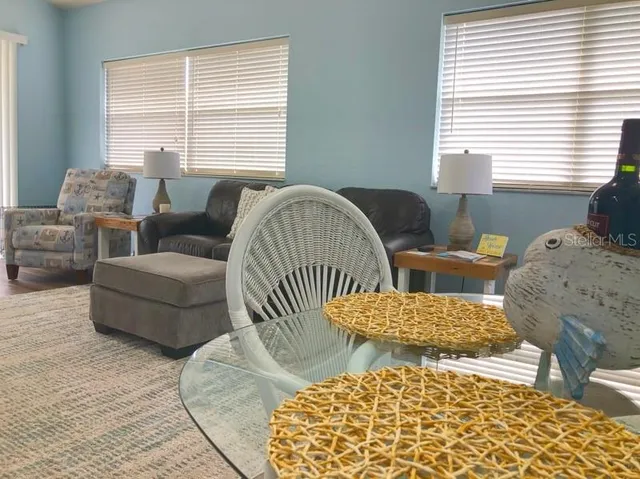 a living room with furniture and a window