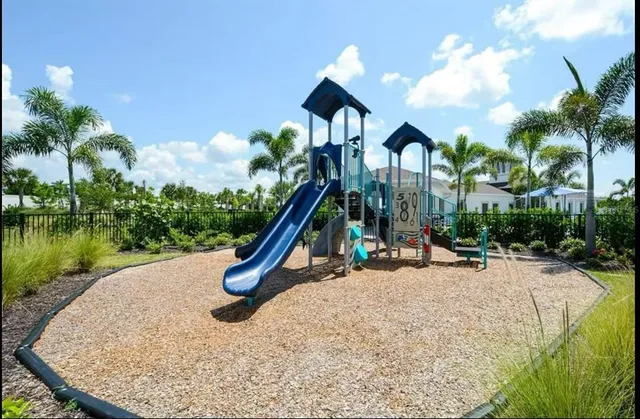 a view of a park with large trees