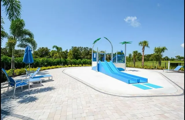 a view of a playground with basketball court