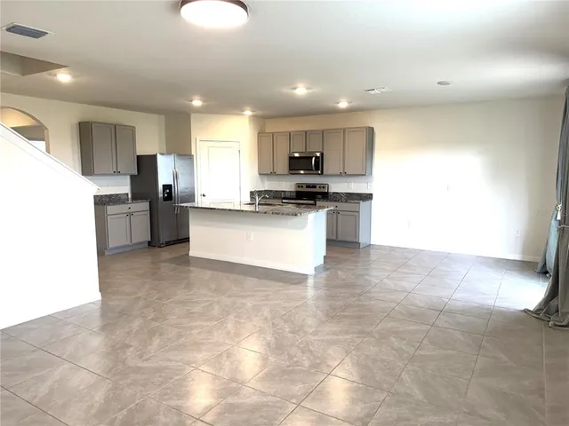 a view of a kitchen with a sink and a window