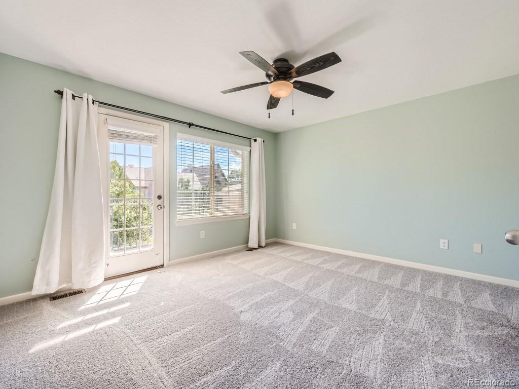 950 Elmhurst Drive, Unit E Highlands Ranch, CO 80129 - Photo 14 of 28 a view of an empty room with a window