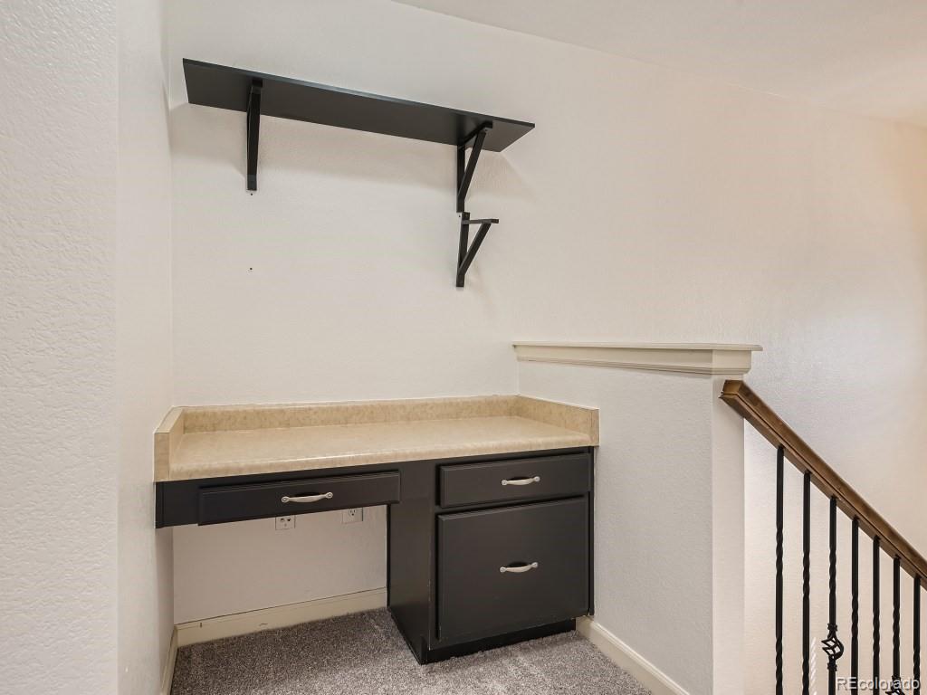 950 Elmhurst Drive, Unit E Highlands Ranch, CO 80129 - Photo 21 of 28 a room with storage and utility