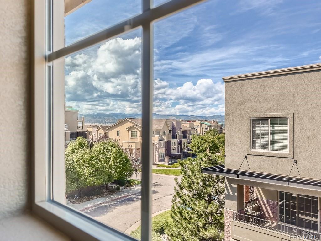 950 Elmhurst Drive, Unit E Highlands Ranch, CO 80129 - Photo 23 of 28 a view of a window with a tree in front of it