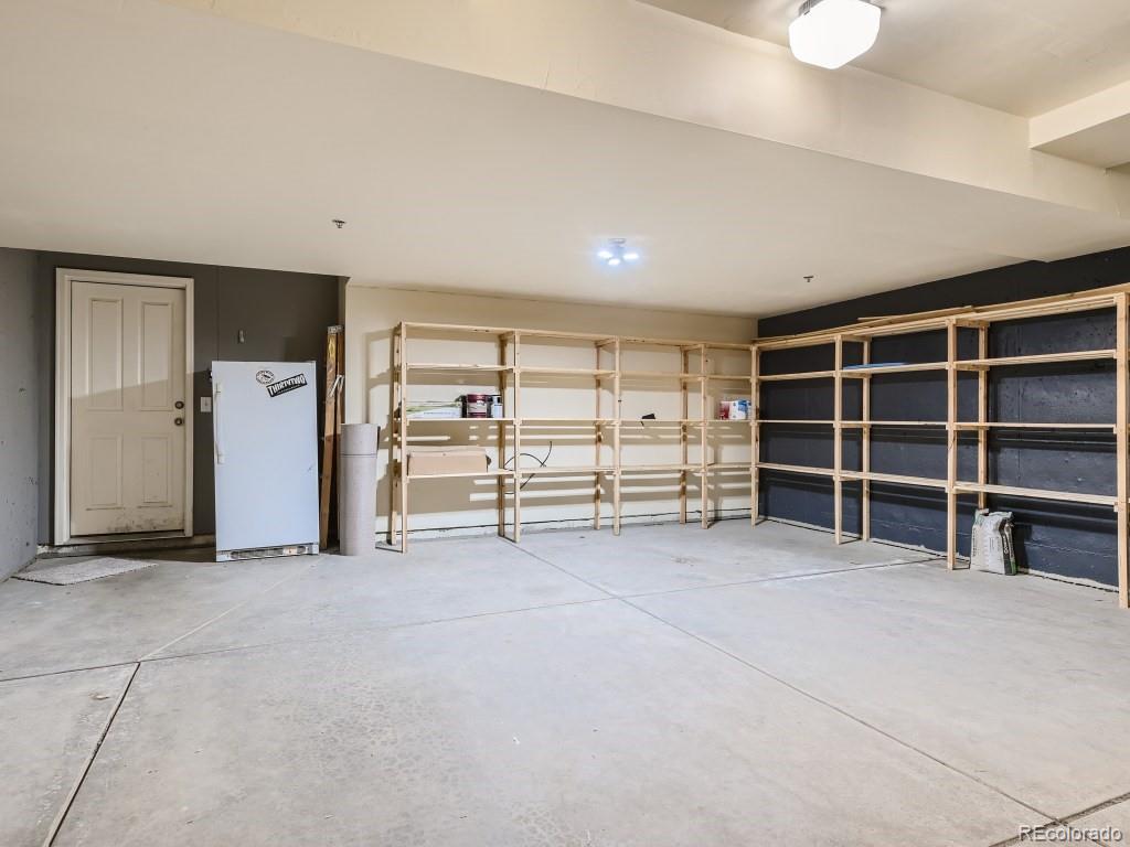 950 Elmhurst Drive, Unit E Highlands Ranch, CO 80129 - Photo 24 of 28 a view of an empty room with closet and a window