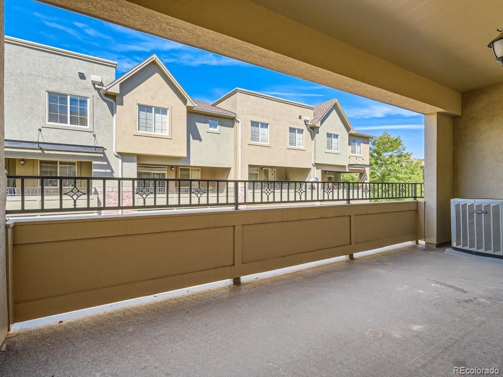 950 Elmhurst Drive, Unit E Highlands Ranch, CO 80129 - Photo 26 of 28 a view of a house with a balcony