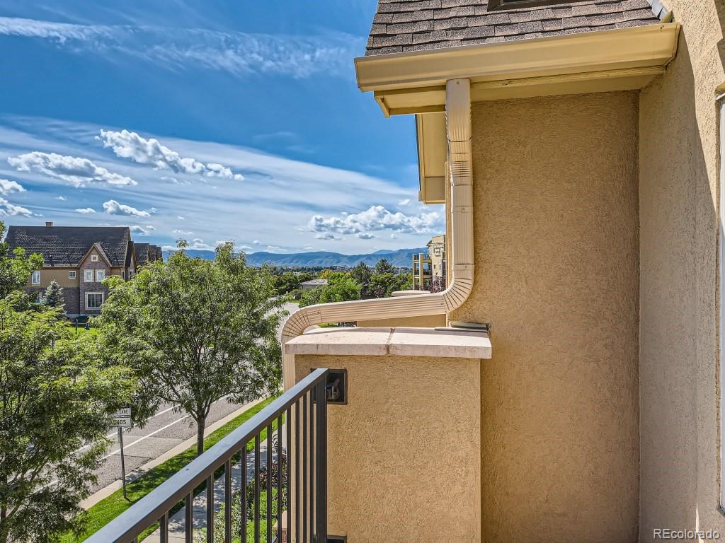 950 Elmhurst Drive, Unit E Highlands Ranch, CO 80129 - Photo 27 of 28 a view of a balcony with an outdoor space