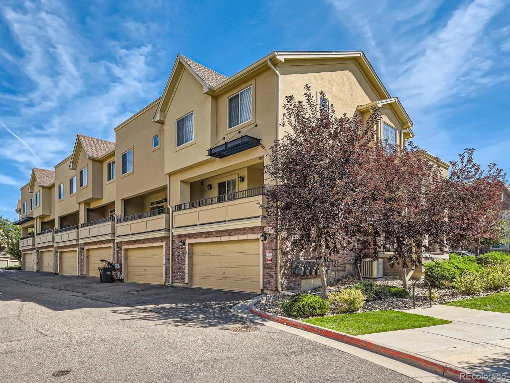 950 Elmhurst Drive, Unit E Highlands Ranch, CO 80129 - Photo 28 of 28 a view of a house with a yard
