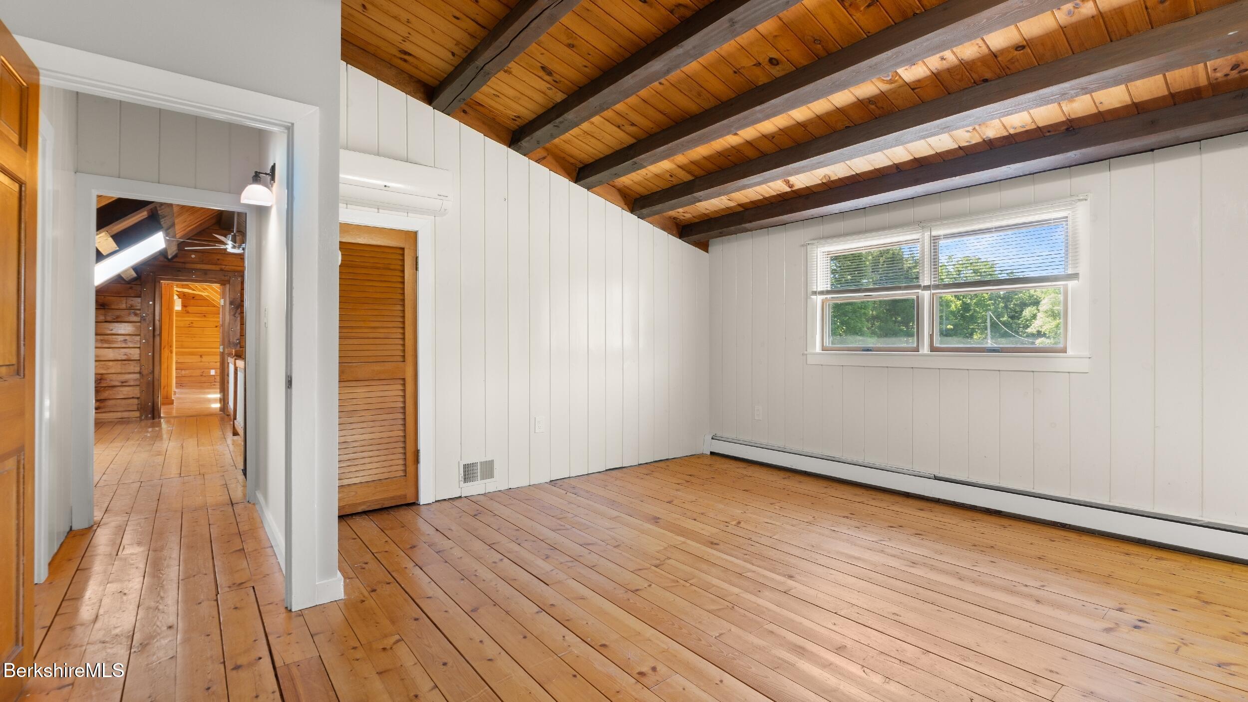 134 Hurlburt Road Great Barrington, MA 01230 - Photo 37 of 50 a view of empty room with wooden floor