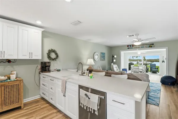 a kitchen that has a sink and a large window