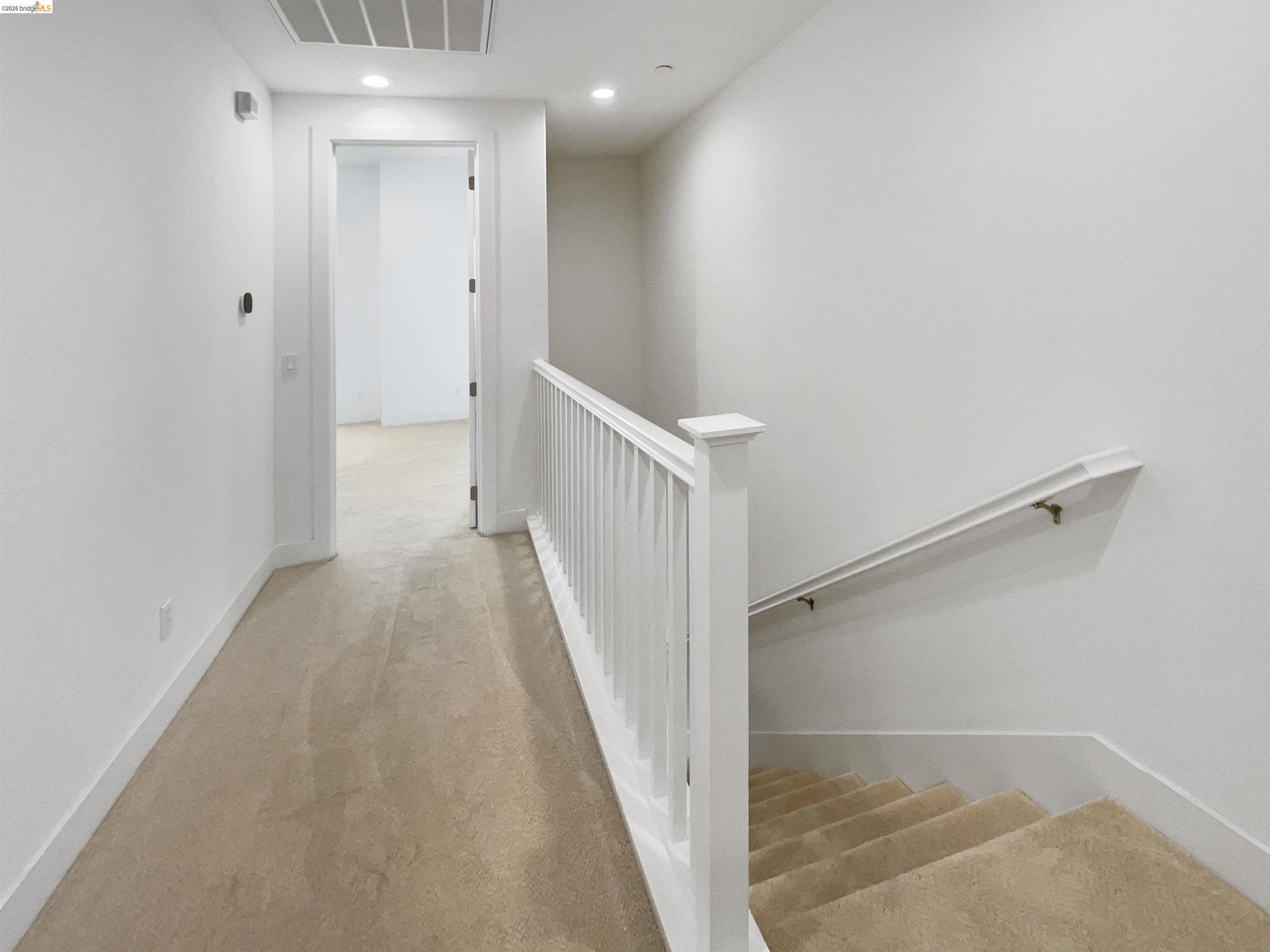 3419 Router Common Fremont, CA 94538 - Photo 20 of 26 Corridor featuring an upstairs landing, light colored carpet, and recessed lighting