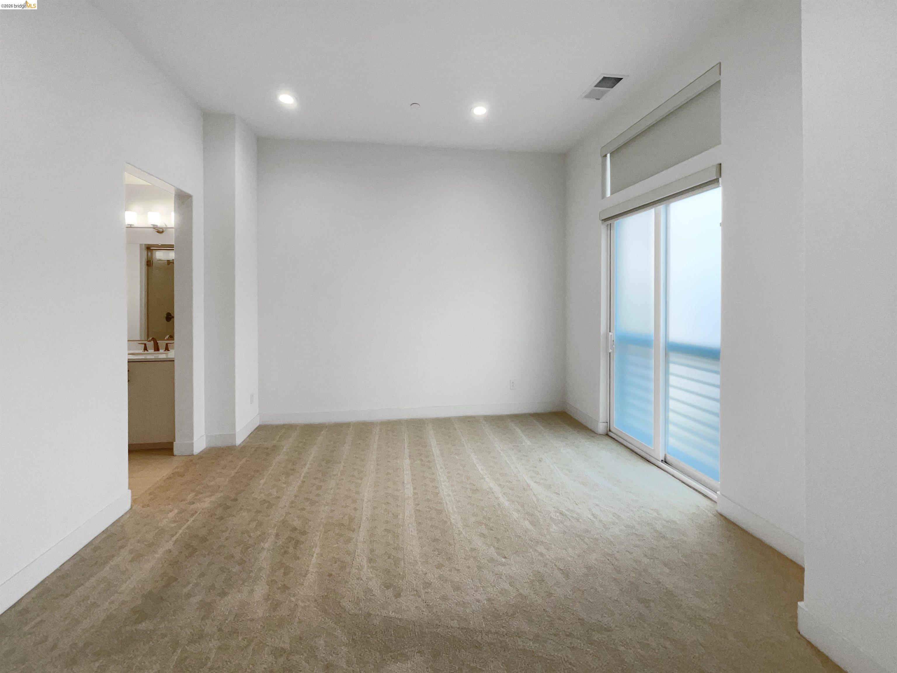 3419 Router Common Fremont, CA 94538 - Photo 21 of 26 Unfurnished room with light carpet and recessed lighting