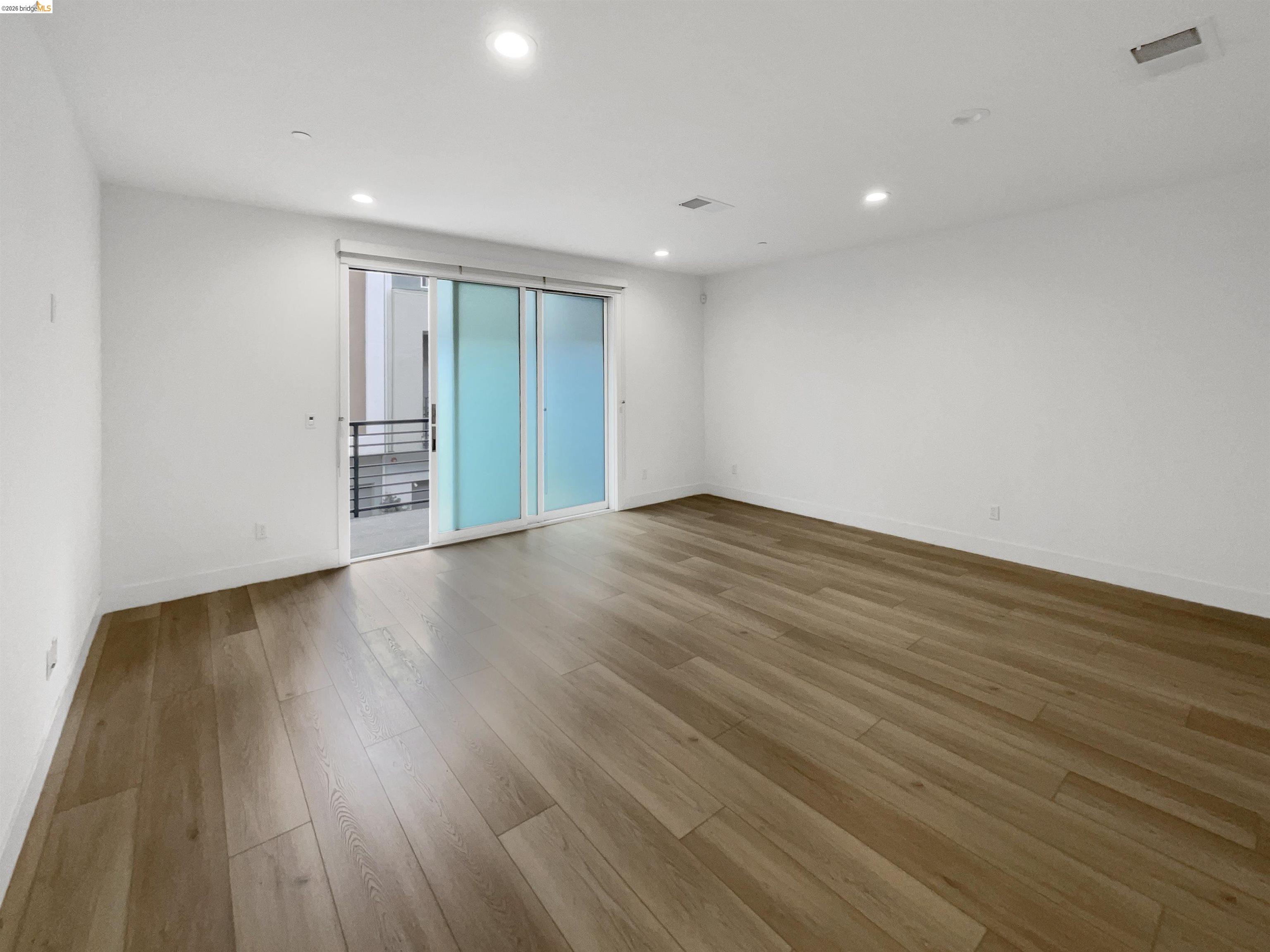 3419 Router Common Fremont, CA 94538 - Photo 3 of 26 Unfurnished room with recessed lighting and light wood-style floors