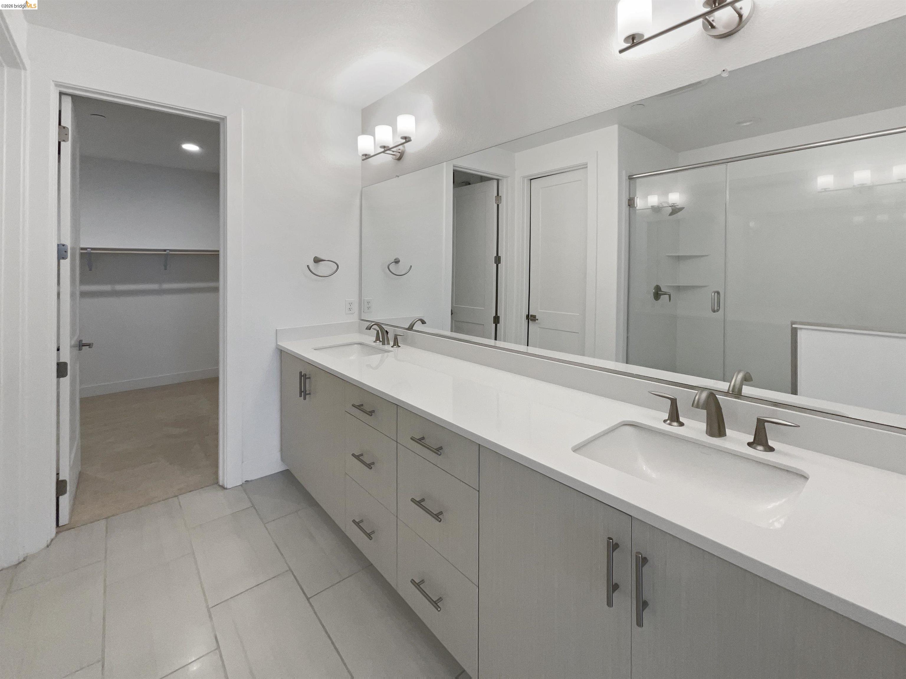 3419 Router Common Fremont, CA 94538 - Photo 6 of 26 Bathroom featuring a shower stall, double vanity, a spacious closet, and recessed lighting