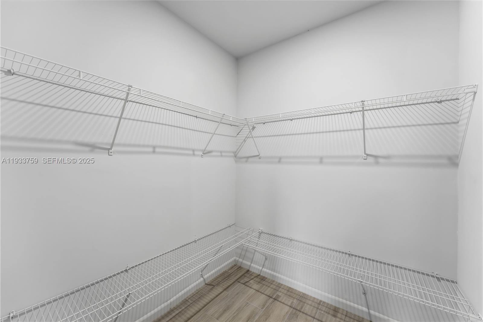 1393 Northwest 31st Street, Unit A Miami, FL 33142 - Photo 13 of 21 a view of a room with racks on the wall