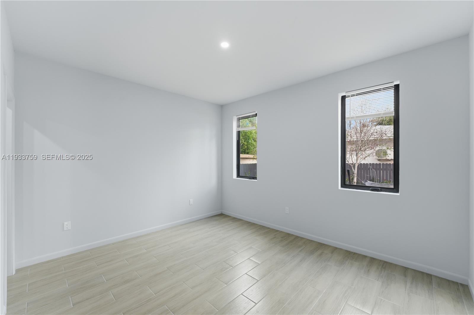 1393 Northwest 31st Street, Unit A Miami, FL 33142 - Photo 10 of 21 an empty room with a window