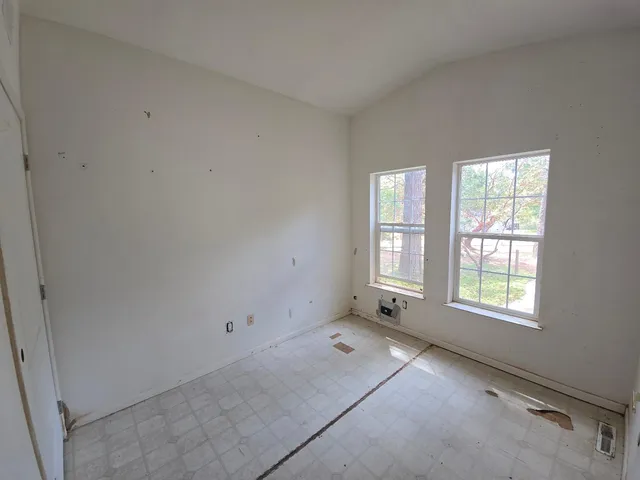 an empty room with windows