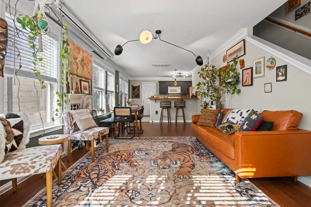 a living room with fireplace furniture and a flat screen tv