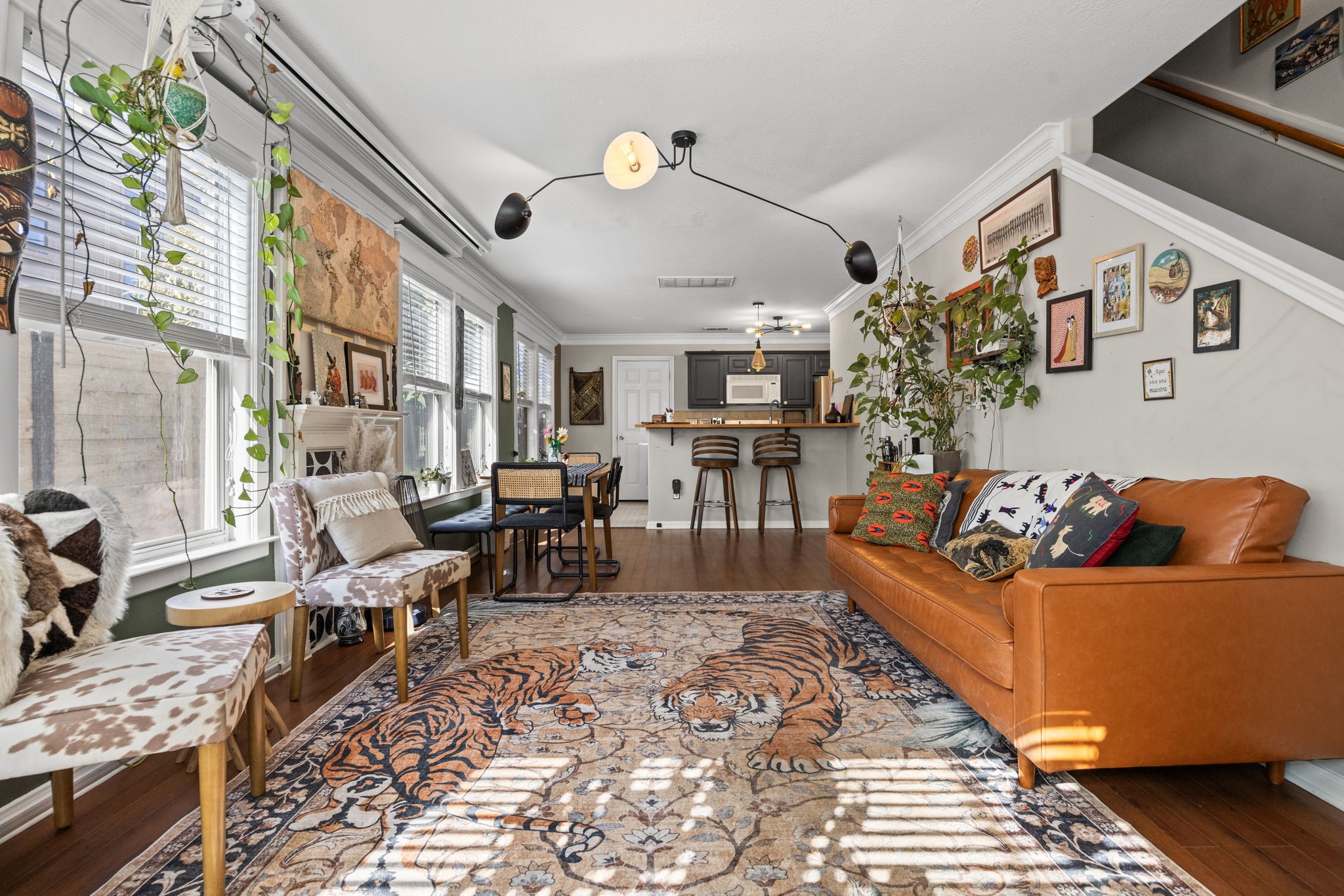 a living room with fireplace furniture and a flat screen tv