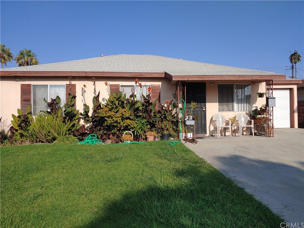 18628 Bonham Avenue Carson, CA 90746 - Photo 1 of 1 a front view of a house with garden