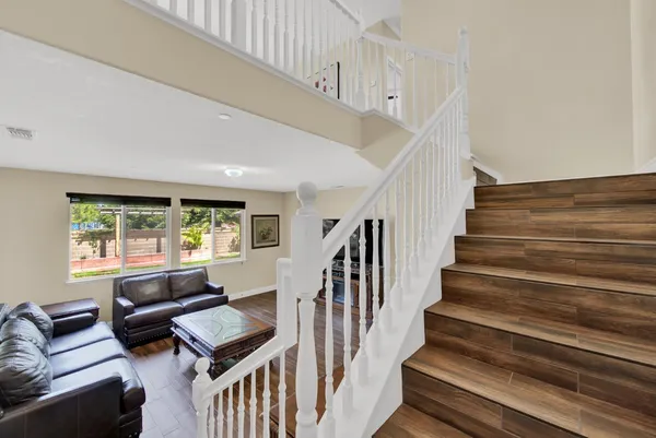 a view of hallway with wooden floor