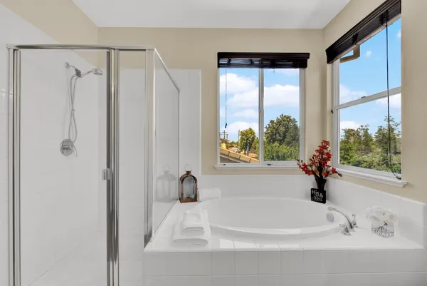 a white toilet sitting next to a bathroom sink