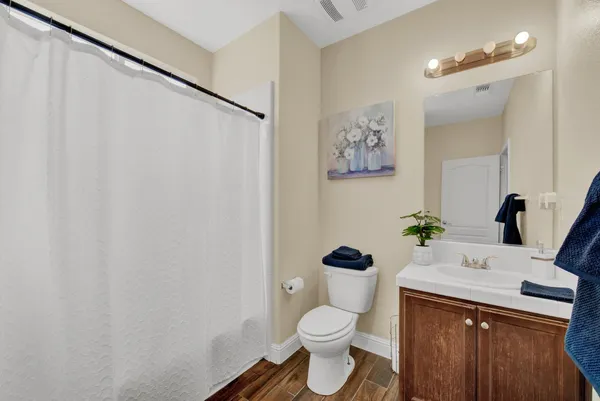 a view of a house with a backyard patio and swimming pool