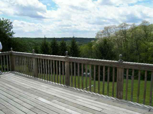 4374 South Derinda Road Elizabeth, IL 61028 - Photo 5 of 7 a view of balcony with wooden floor