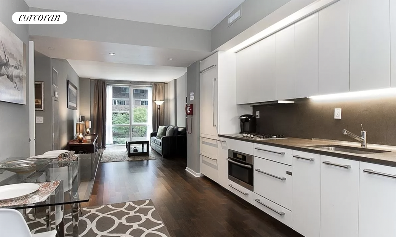 340 East 23rd Street, Unit 3K Manhattan, NY 10010 - Photo 1 of 10 a large white kitchen with a large window